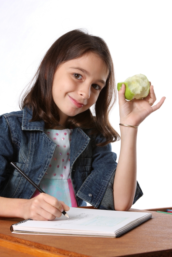 Student working with healthy snack.